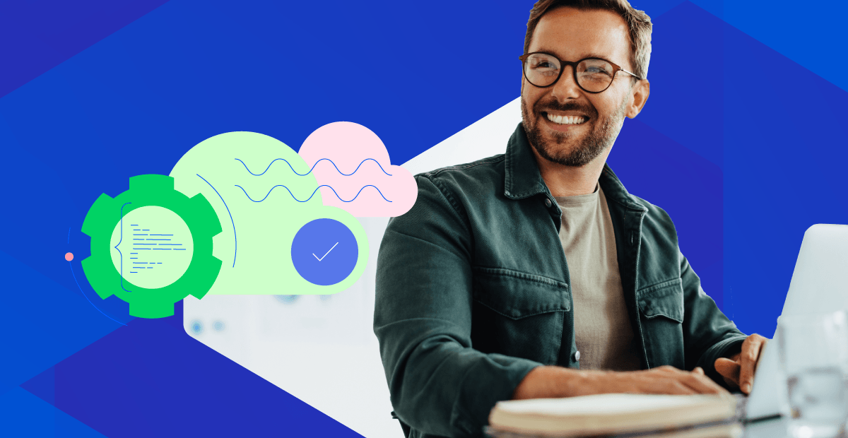 Man on laptop smiling Thumbnail