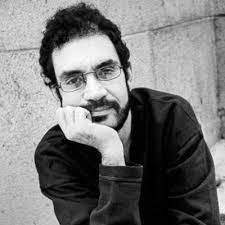 Man wearing a long sleeve shirt and glasses
