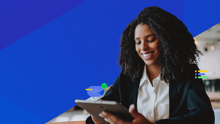 Woman smiling down at device