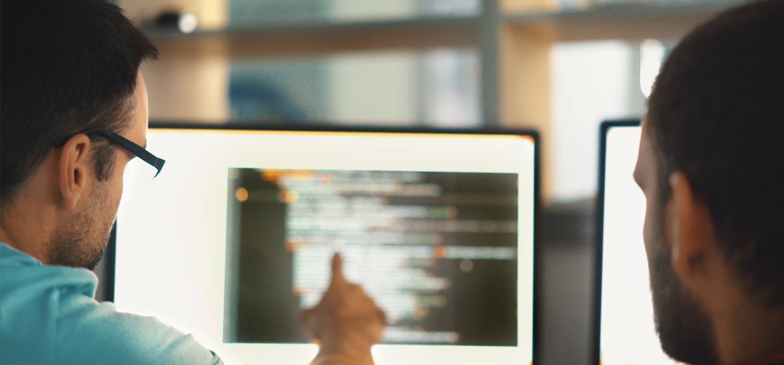 Developers looking at screen
