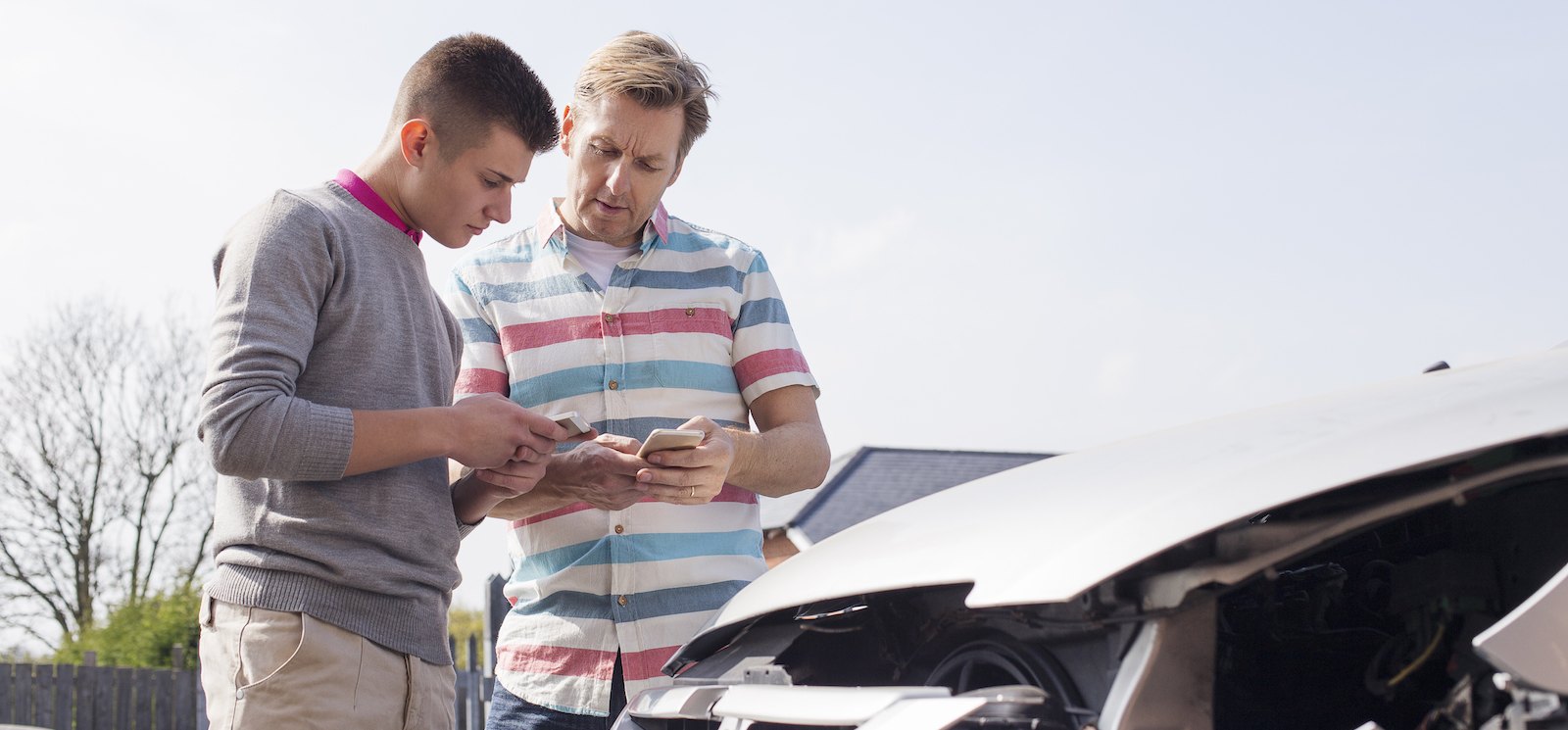 People exchanging insurance information